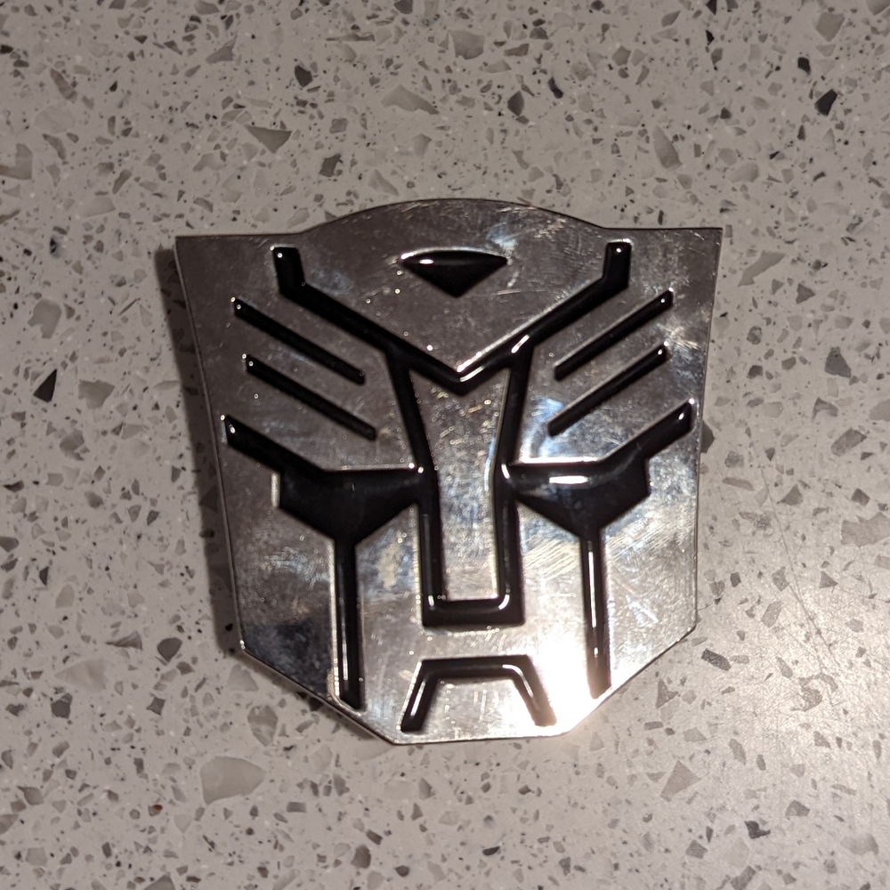 Transformers belt buckle